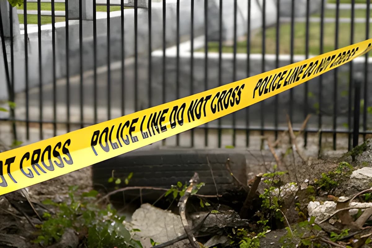 yellow police line tape with 'POLICE LINE DO NOT CROSS' text